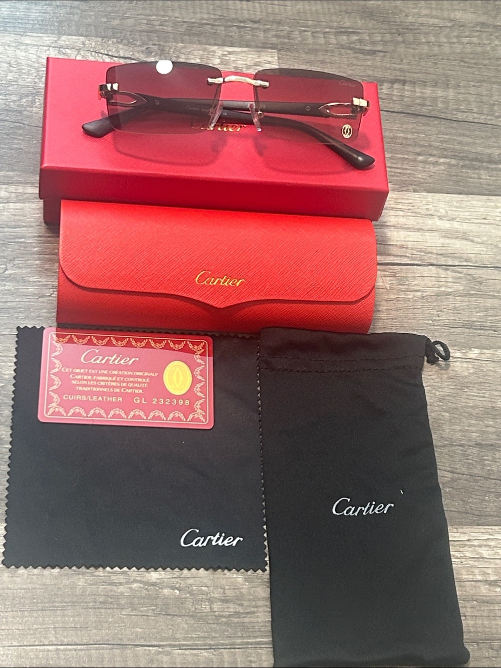 Cartier Men’s Rimless Sunglasses with Dark Brown Lenses and Gold Accents